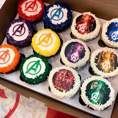 A picture of cupcakes with images on them.